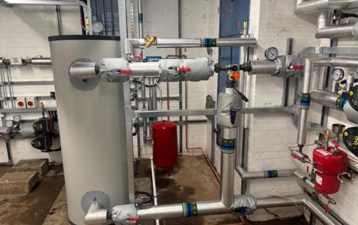 New immersion-feed hot water cylinder in the crematorium's main plant room with associated pump sets