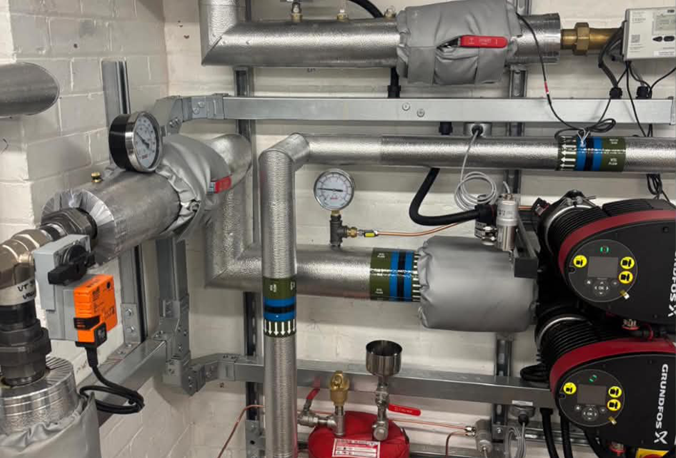 grundfos-pumps-heat-pump-plant-room Grundfos primary circulation pumps and insulated pipework in the new heat pump plant room