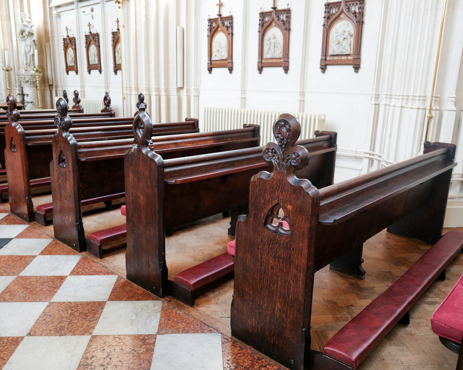 Church heating ready for winter Rows of wooden pews inside a traditional English parish church