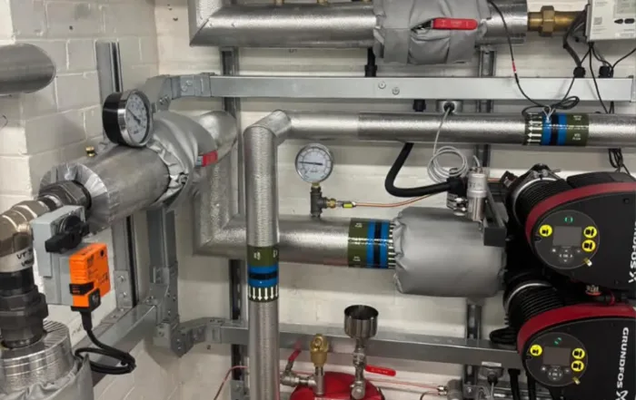 Grundfos primary circulation pumps and insulated pipework in the new heat pump plant room