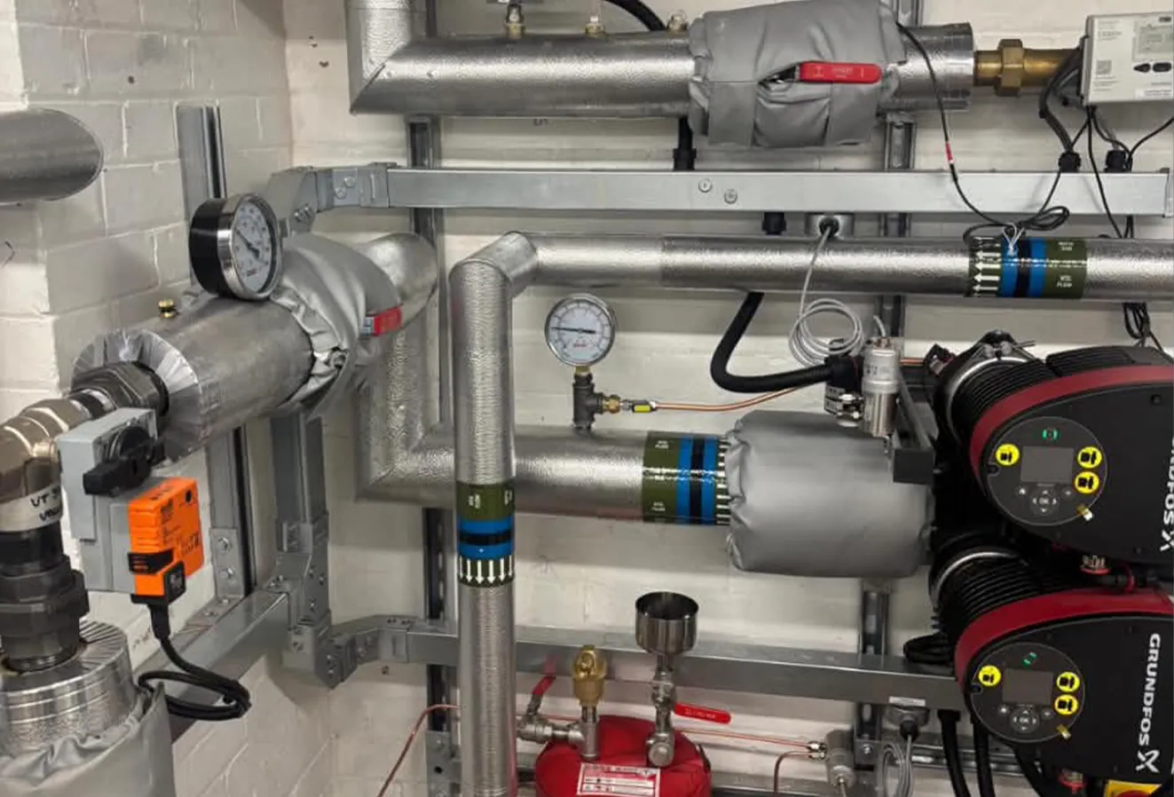 grundfos-pumps-heat-pump-plant-room Grundfos primary circulation pumps and insulated pipework in the new heat pump plant room